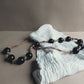 Glaskralen ketting aan touw